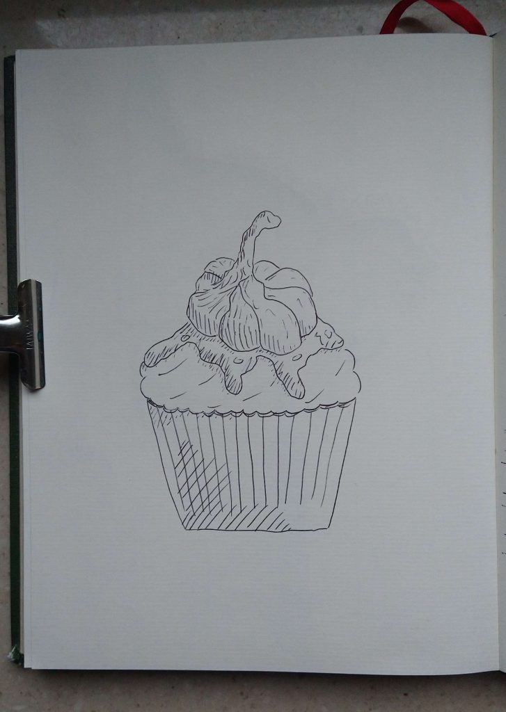 Cupcake mit Knoblauch auf der Glasur. Gemalt mit einem Kugelschreiber.
